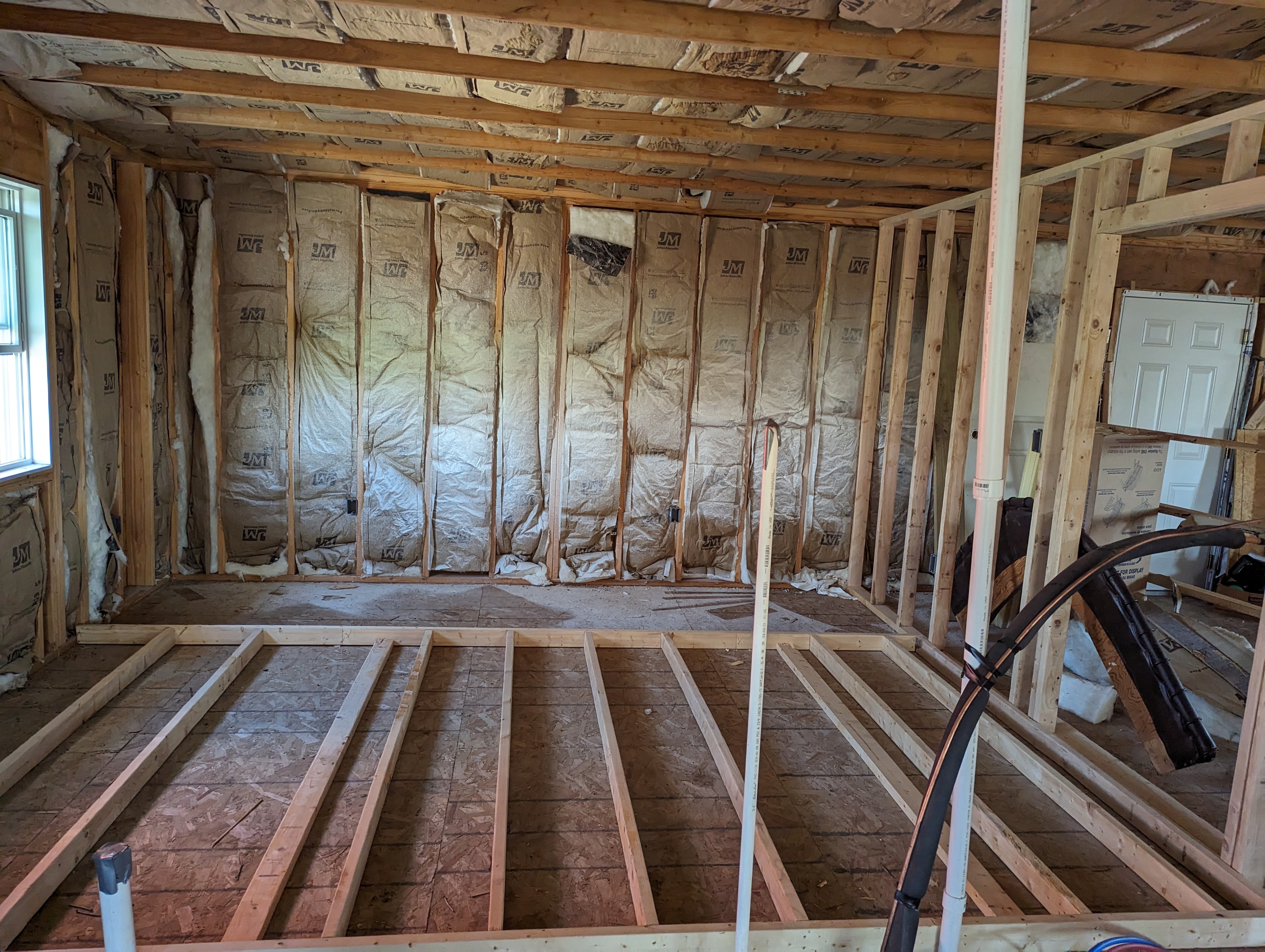 Insulation and floor framing — pre-drywall