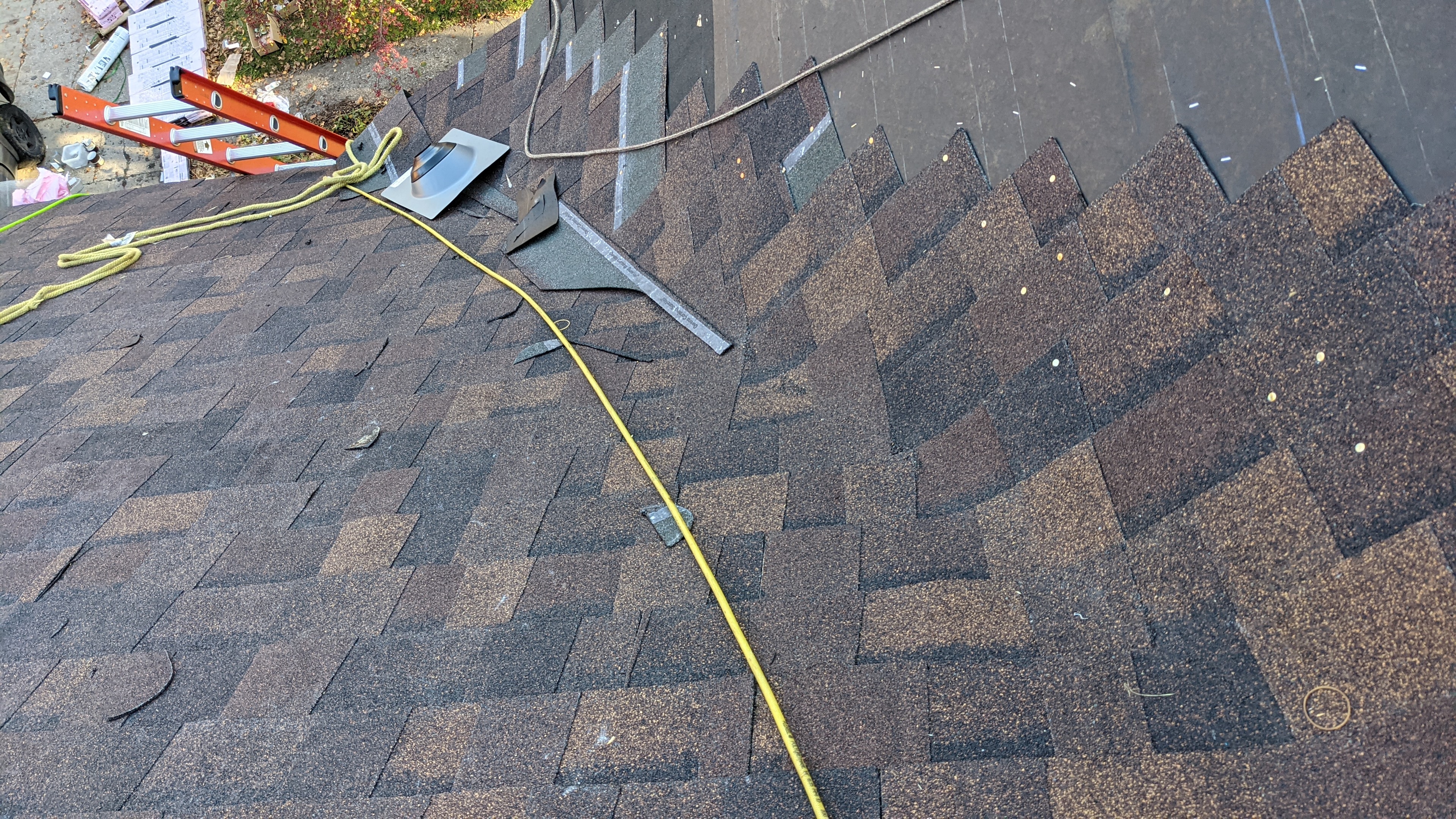 Roofing in progress — shingles and flashing