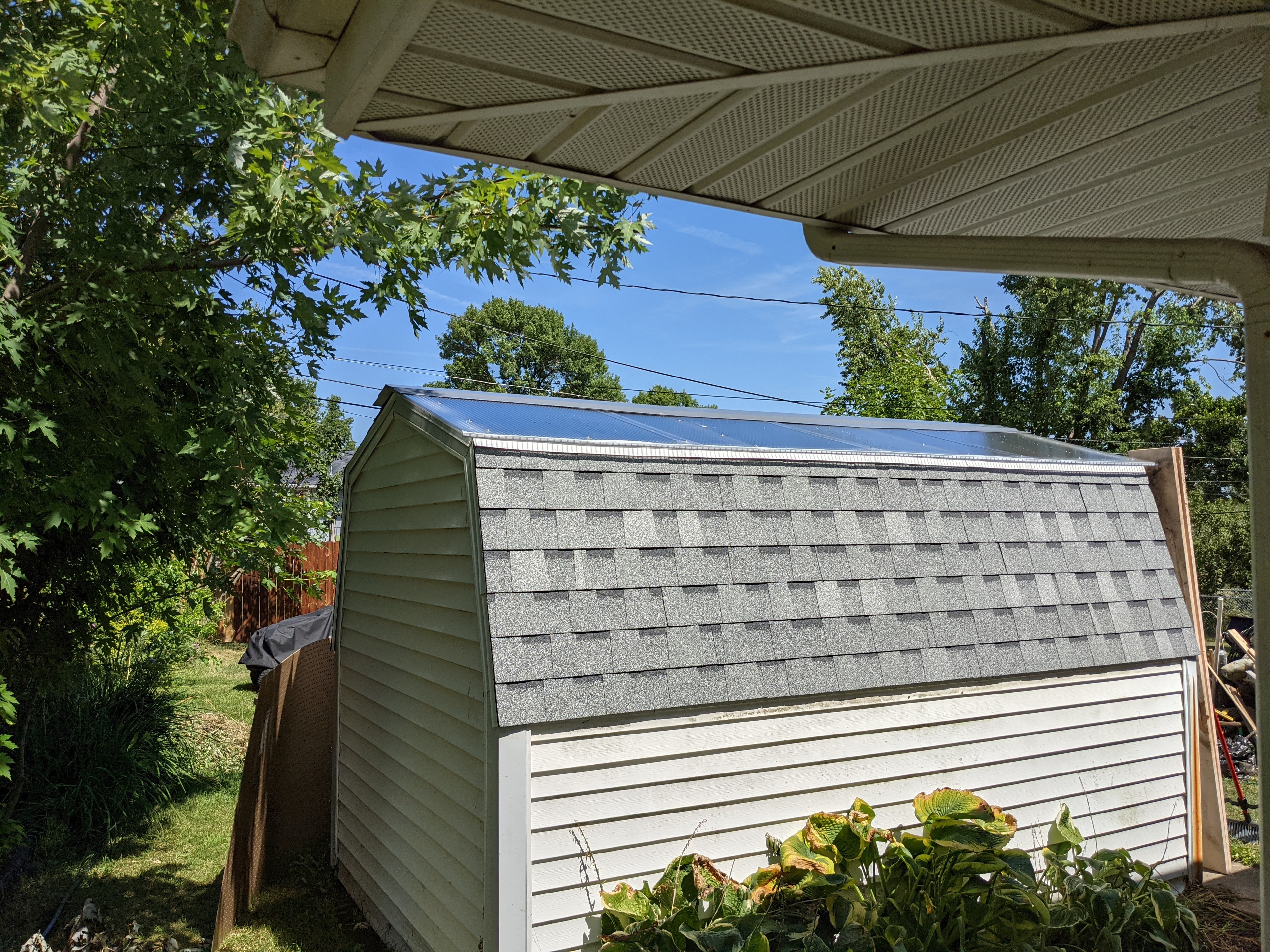 Completed shed roof — gray shingles