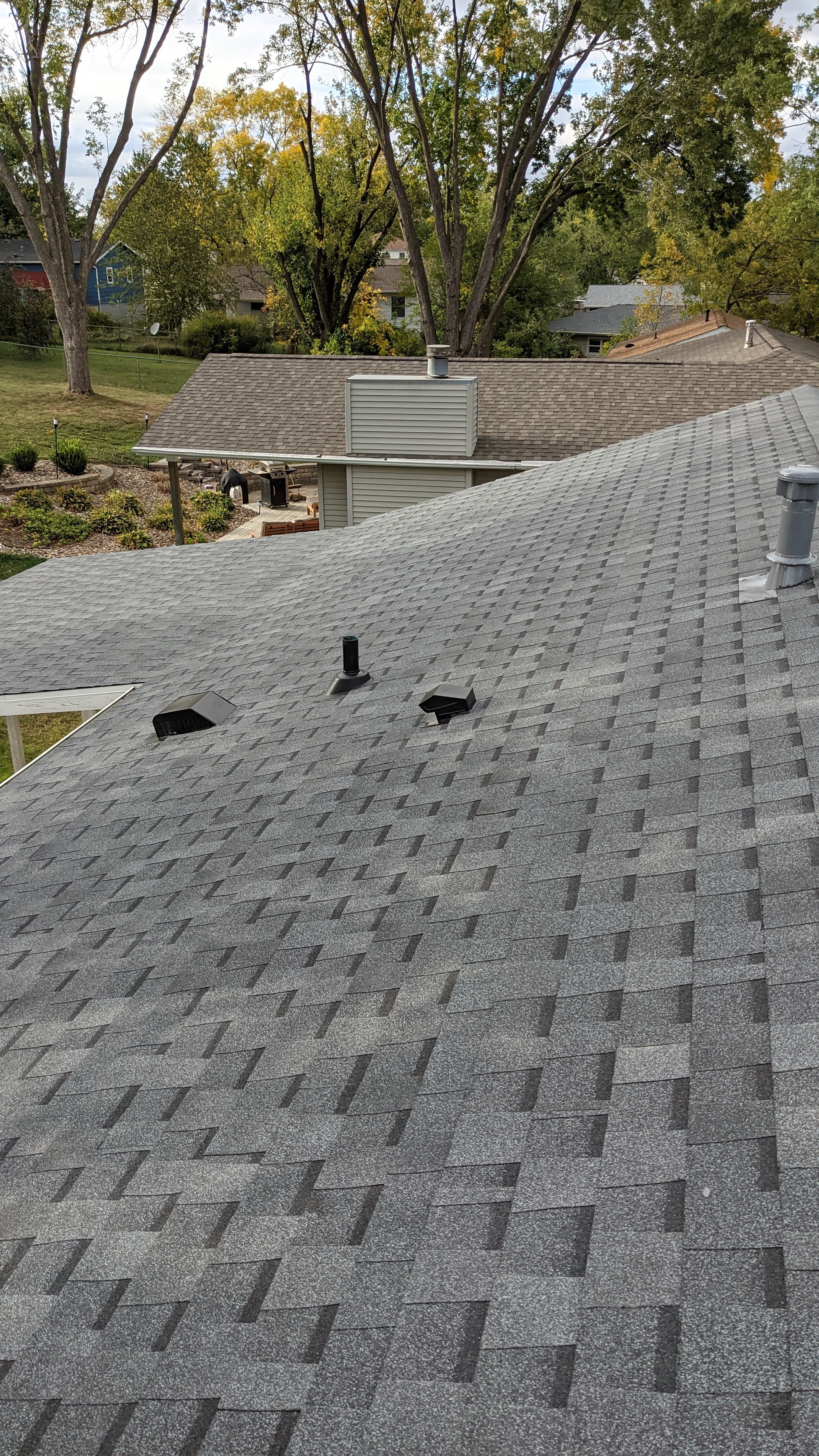 Completed residential roof — gray architectural shingles