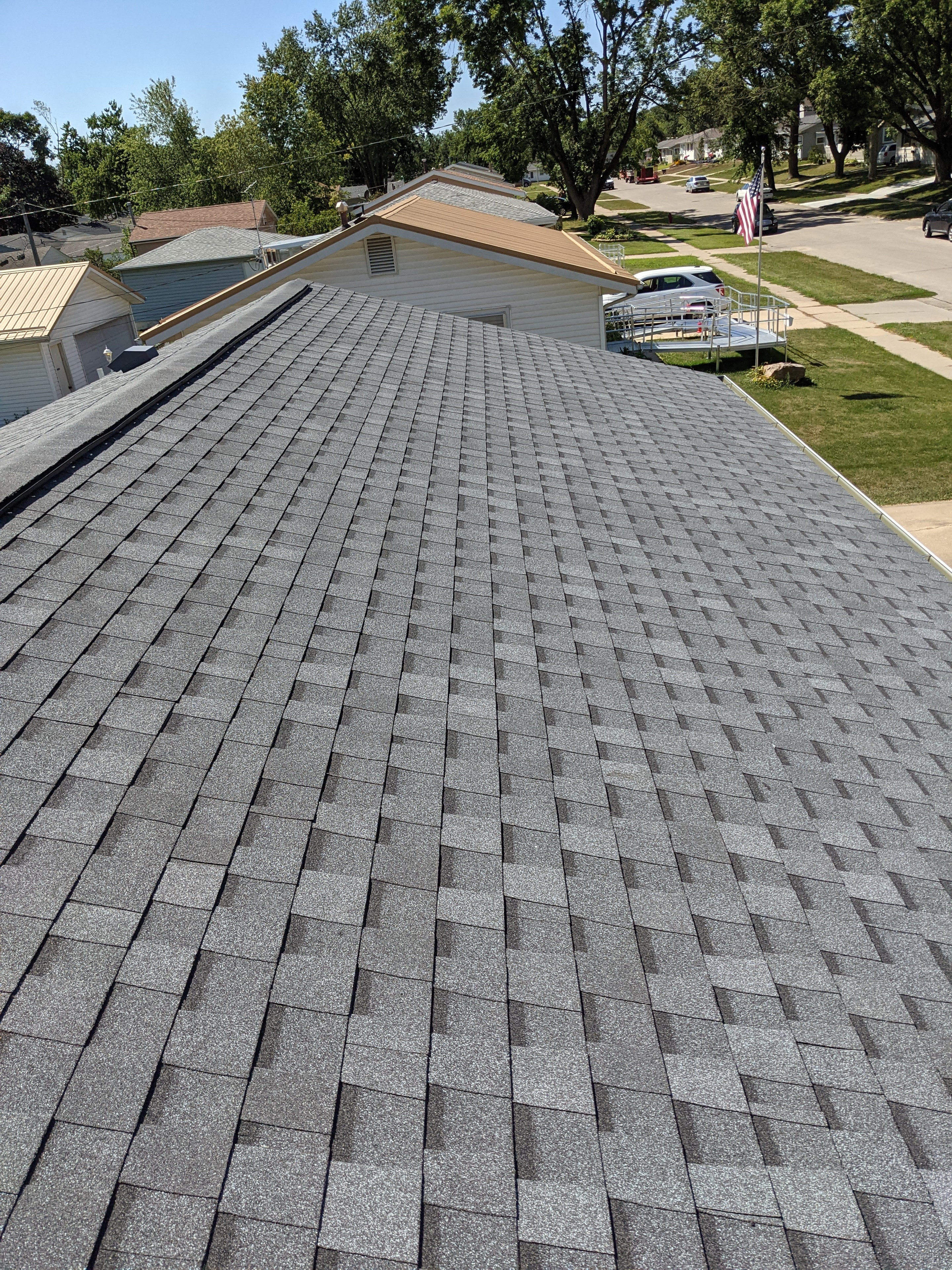 Completed residential roof — gray shingles, aerial view