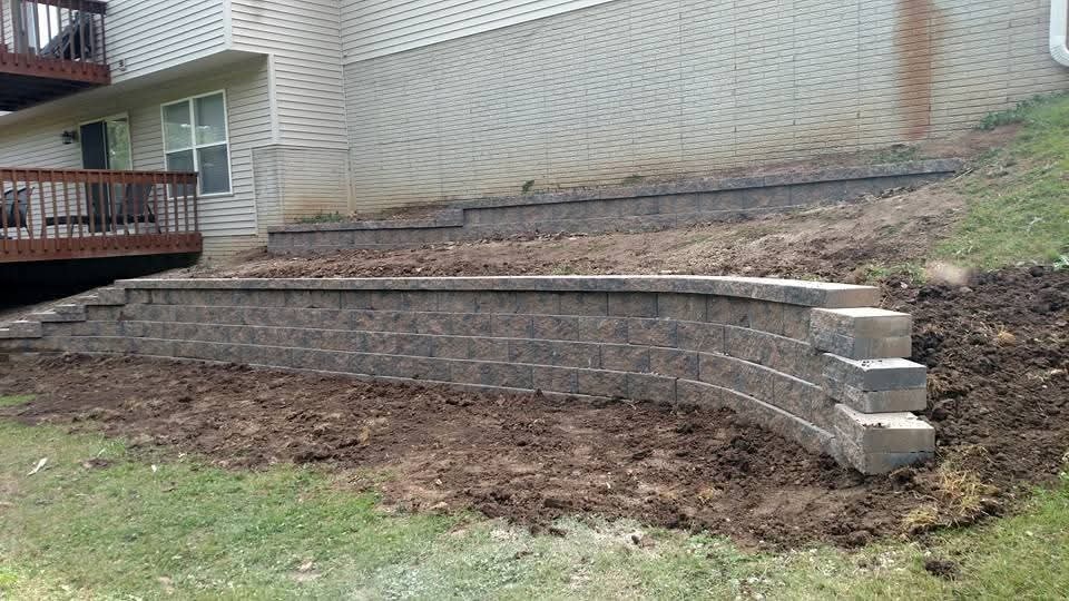 Large curved retaining wall — two-tier system, backyard slope